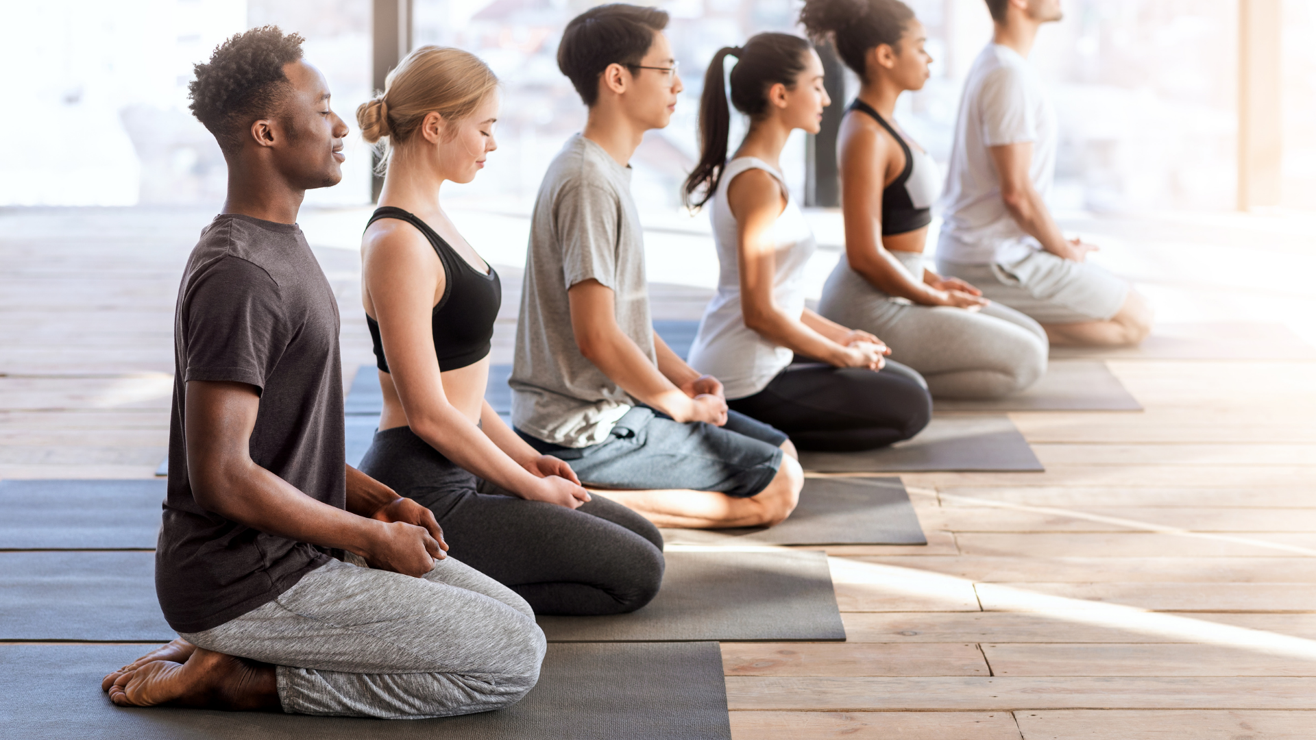 beginner_yoga_students_practicing_yoga_for_stress_reduction