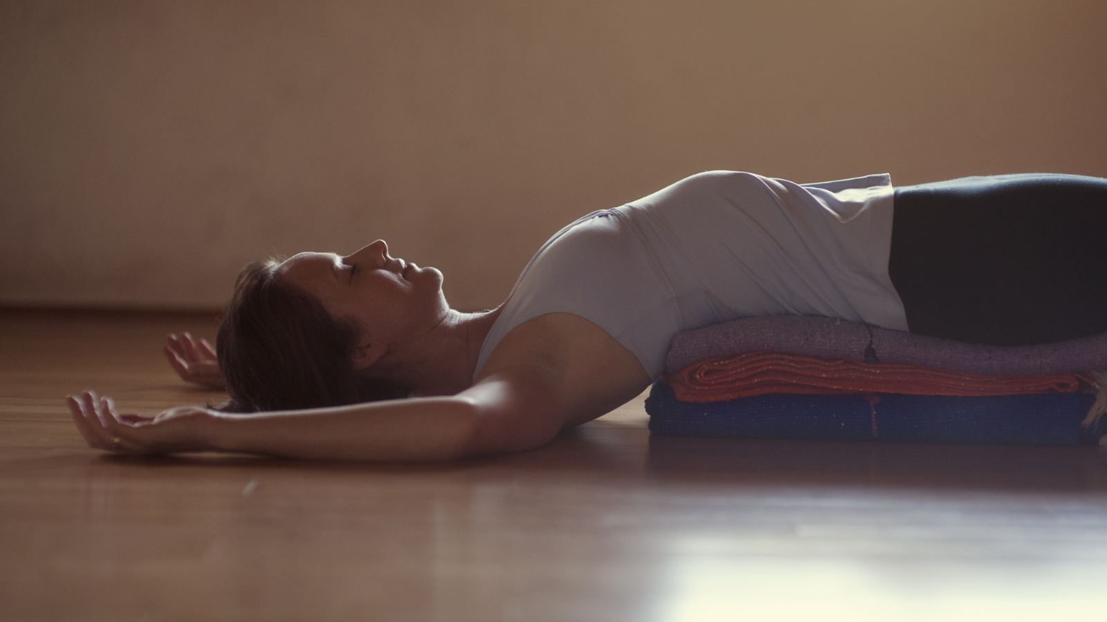 Yoga student practicing Fish Pose (Matsyasana) for stress reduction and avoiding chronic disease
