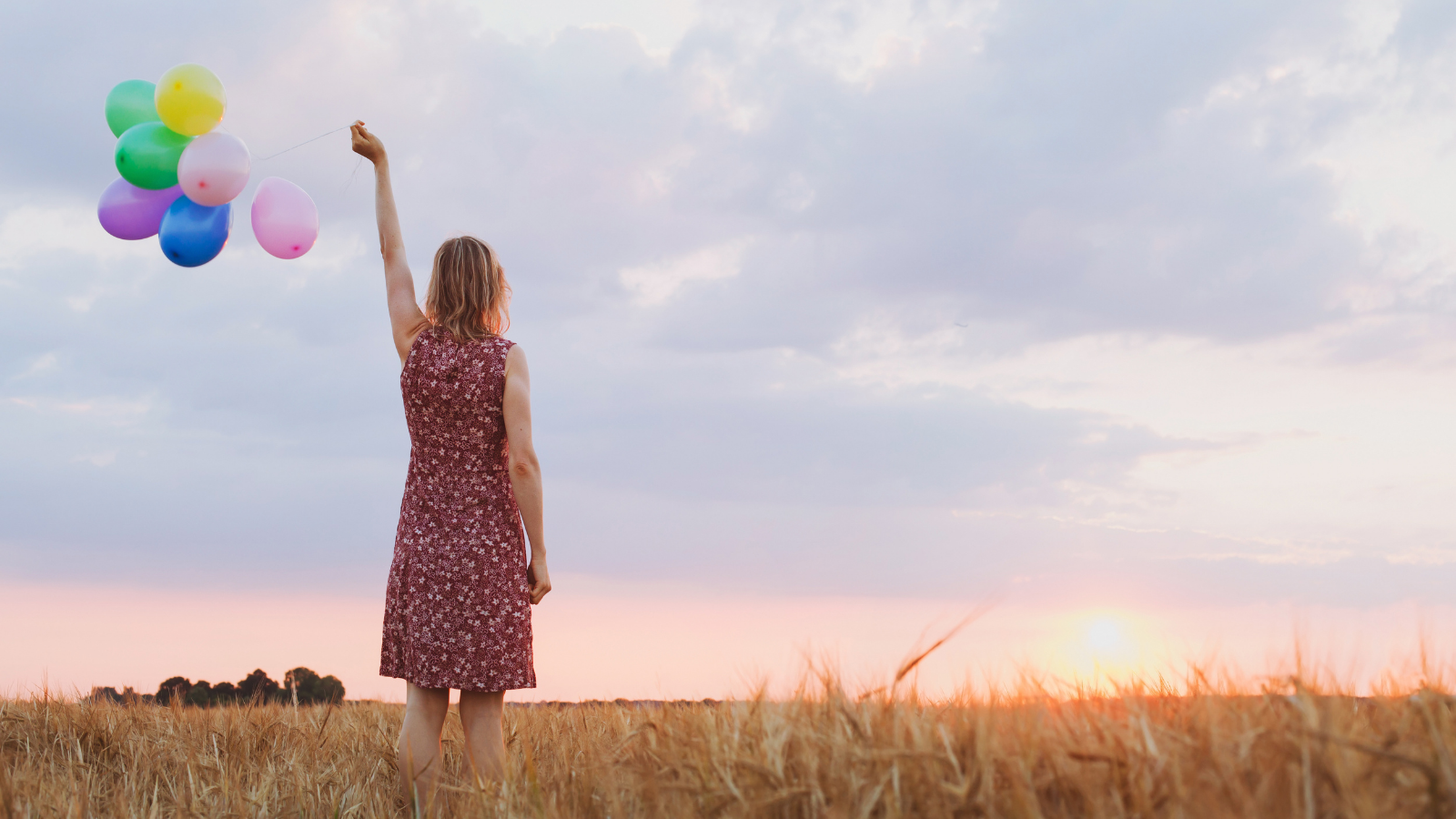 Letting go-this symbol of hope features a woman letting her balloons go