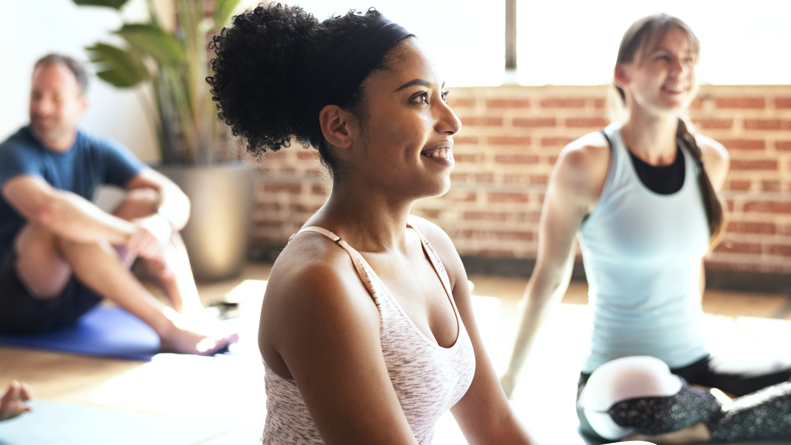 Beginner yoga students in yoga class to increase brain health