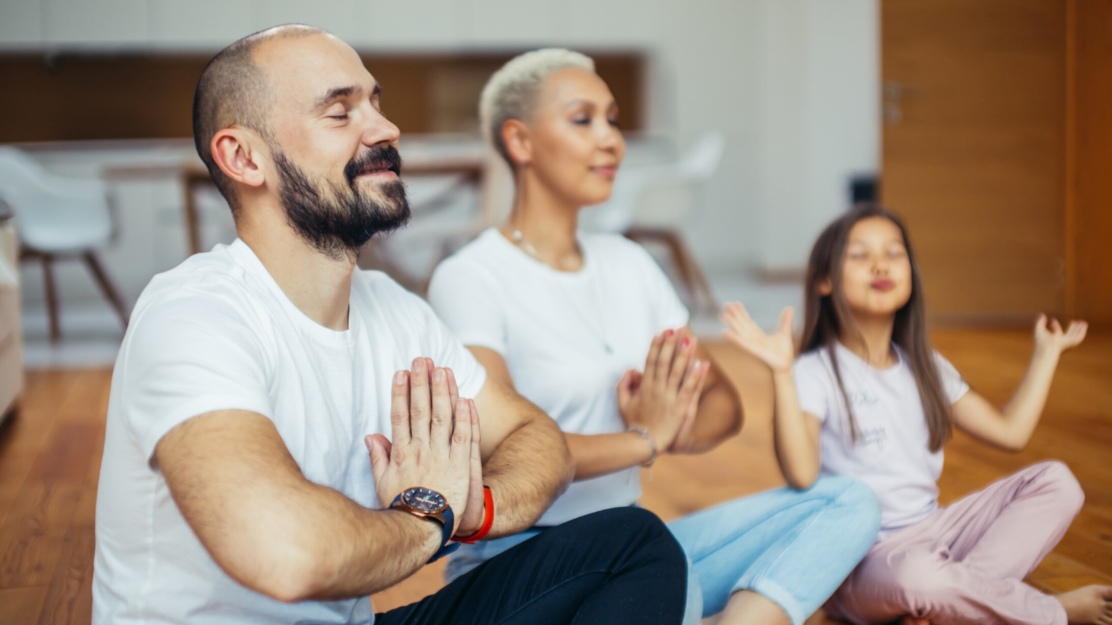 Family practicing yoga meditation at home Family practicing yoga meditation at home
