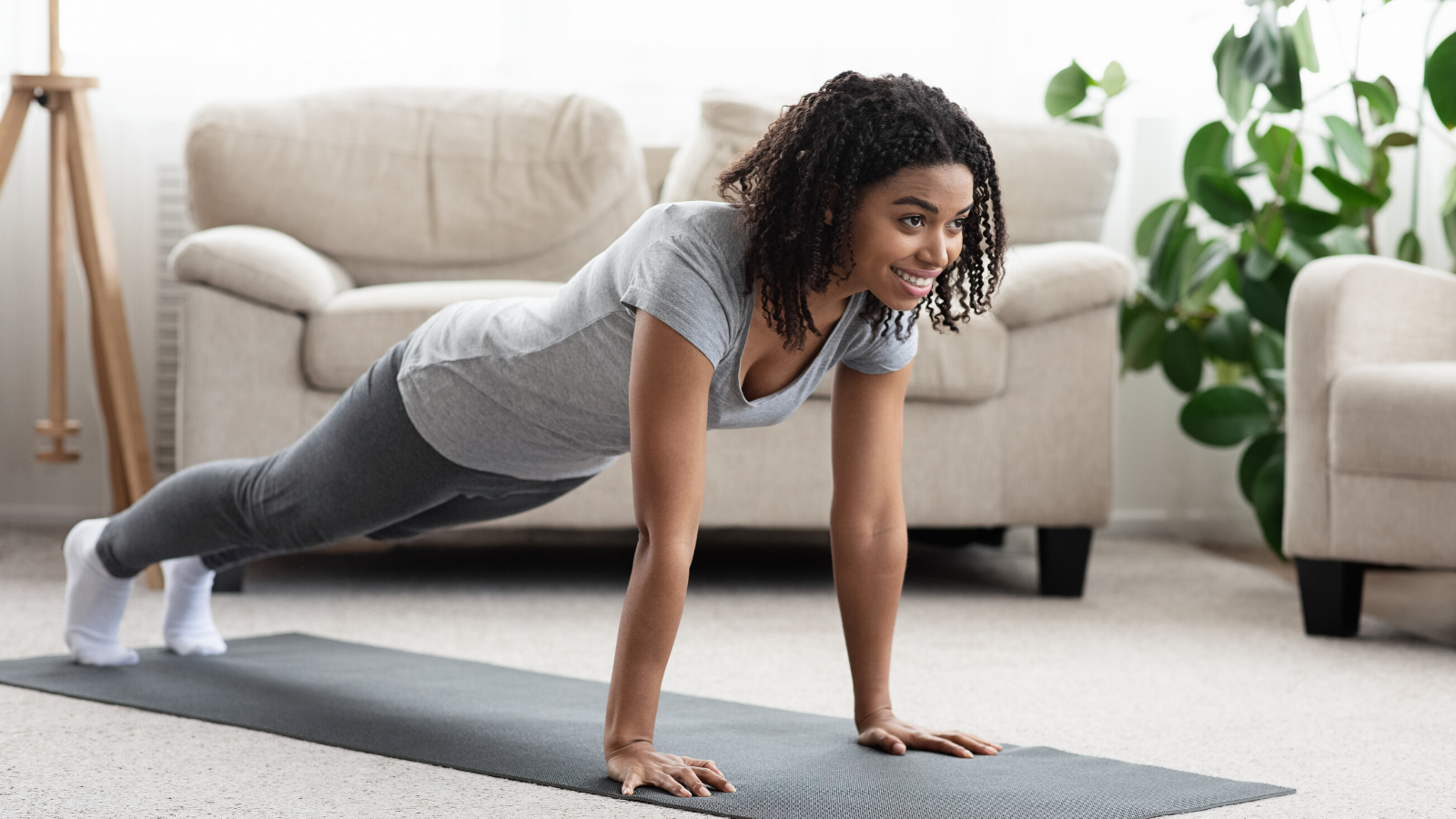female yoga student practicing plank pose