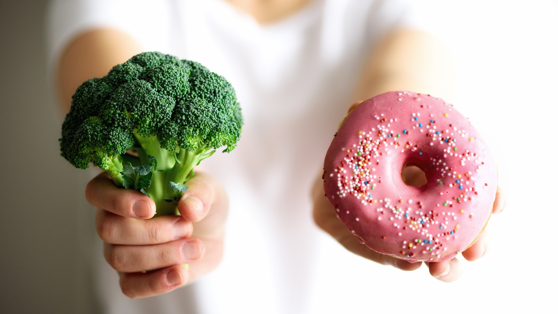 Image of a donut and a head of broccoli.