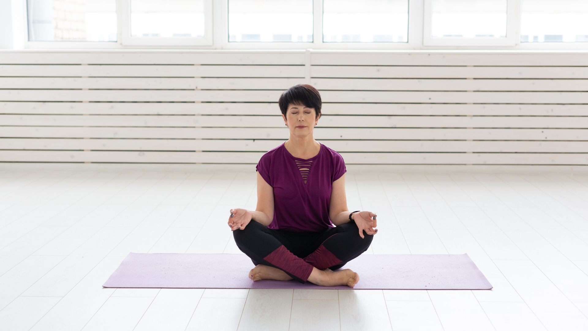 Female yoga student practicing yoga meditation.