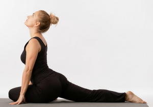 Woman in Pigeon Pose (Kapotasana), practicing awareness of body in yoga