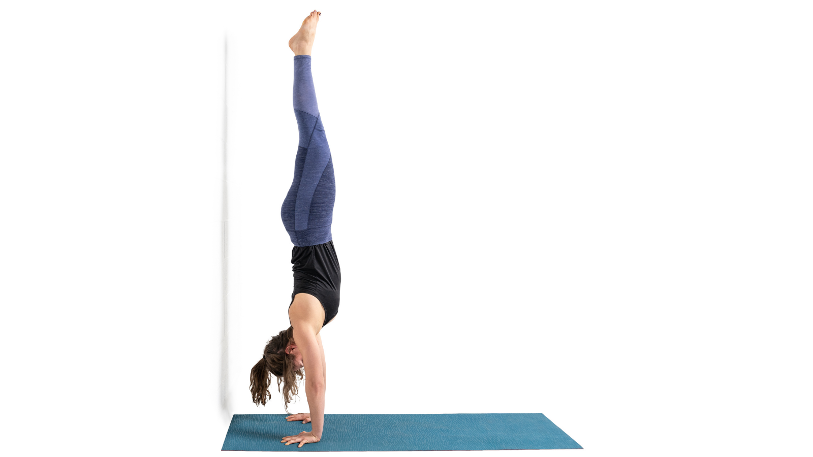 Handstand or Ado Mukha Vrksasana is a stimulating and invigorating yoga pose