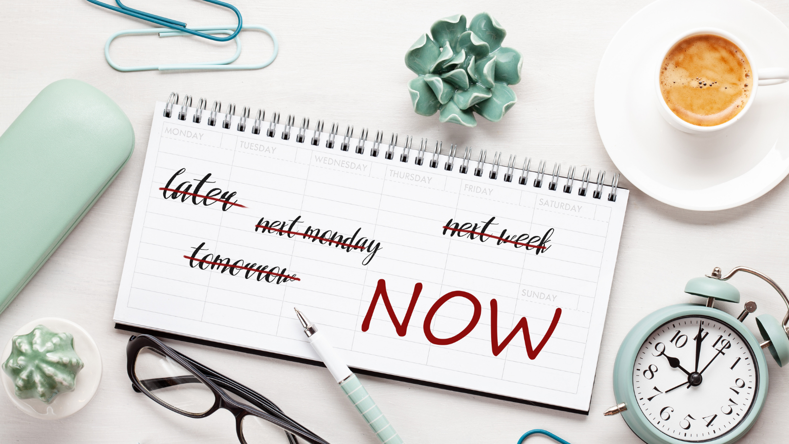 Time management concept with notes in weekly organizer over the desk with coffee and alarm clock. Solution against procrastination
