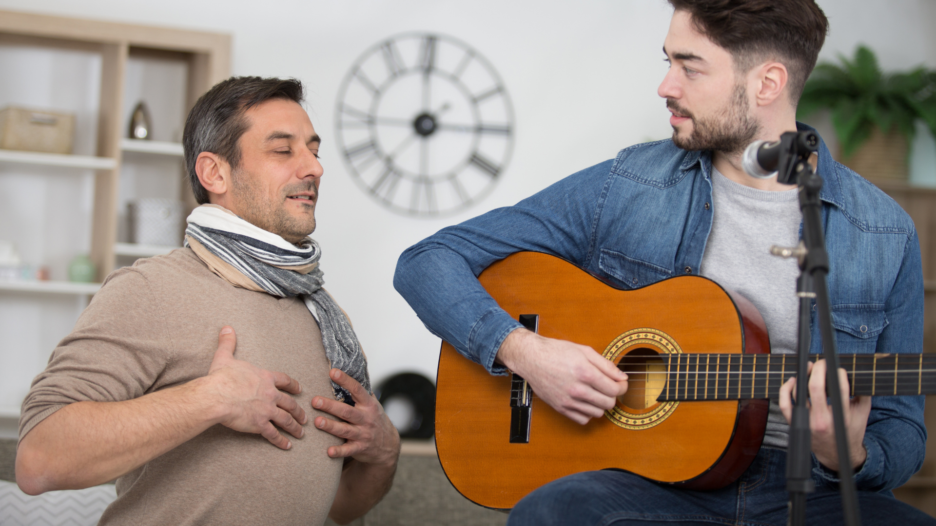Teacher demonstrating a breathing exercise to student musician 
