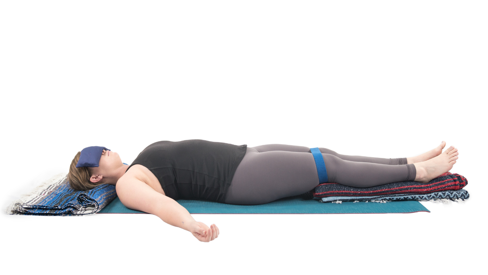 Restorative version of Savasana with support head and legs