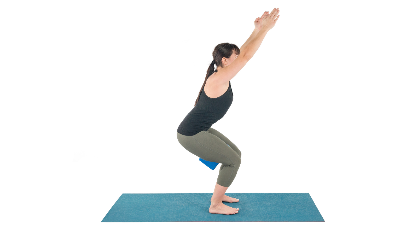 Chair Pose also often called Fierce Pose practiced here with a block to fire up the pose