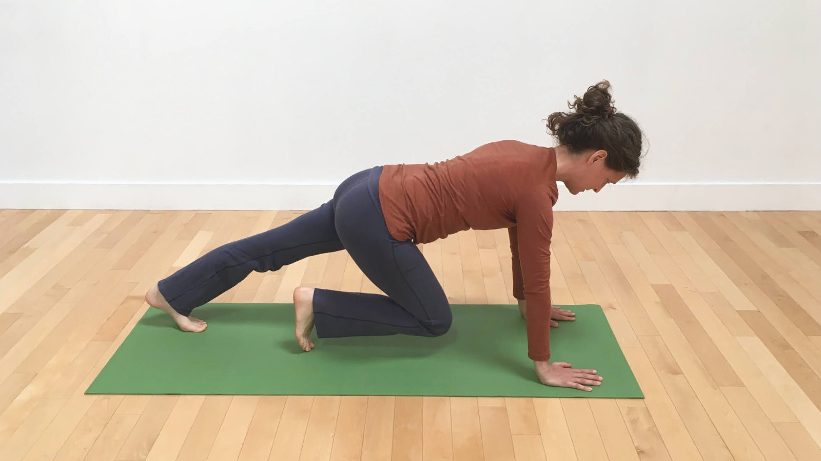 Transitioning toward a Side Plank Pose or Vasisthasana Variation