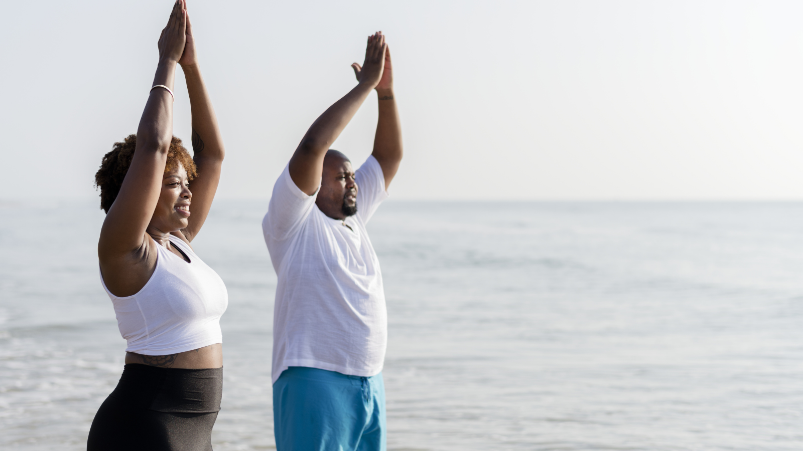 Yoga students practicing yoga to reduce stress and avoid getting sick