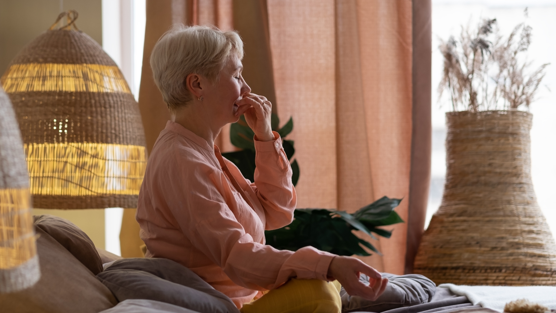 Senior woman practicing yoga and Alternate Nostril Breathing exercise, Nadi Shodhana Pranayama Pose.
