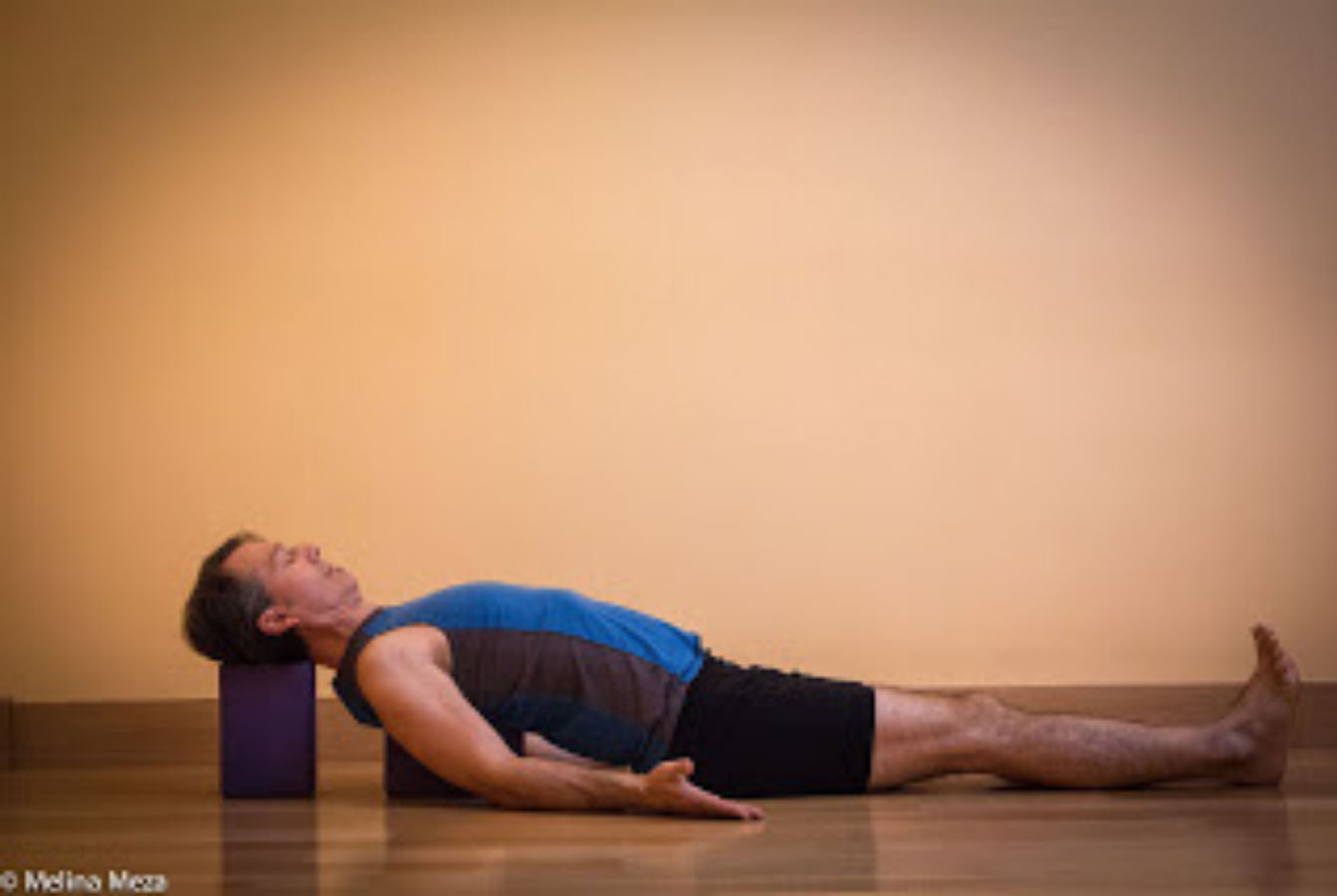 Practicing a Restorative backbend with blocks on higher settings after practicing with blocks on lower settings