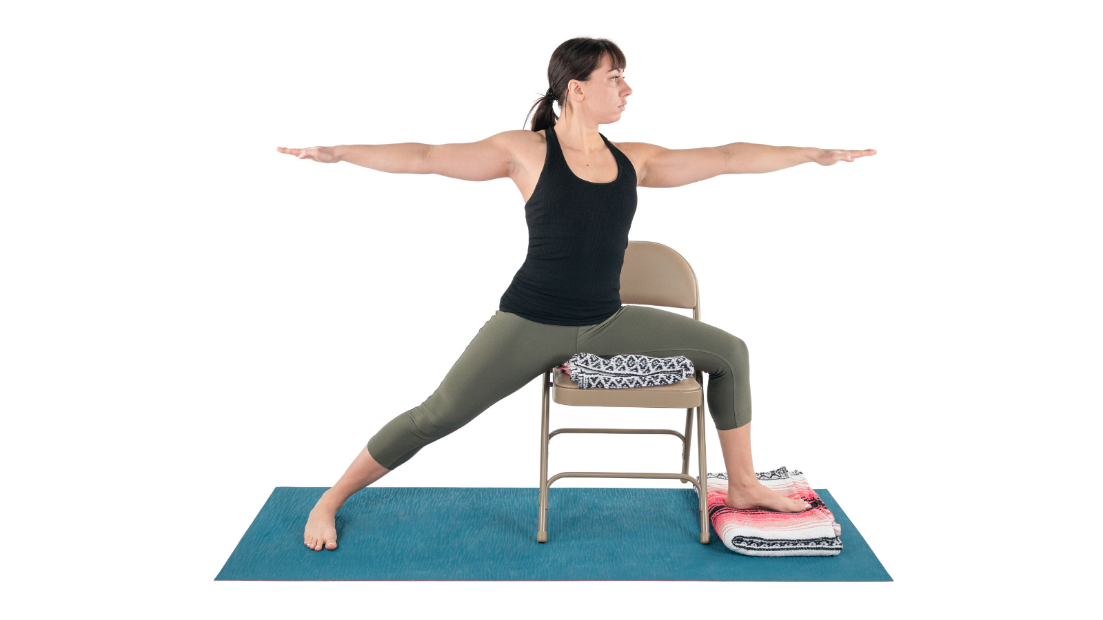 Practicing Warrior 2 Pose with props for comfort and ease
