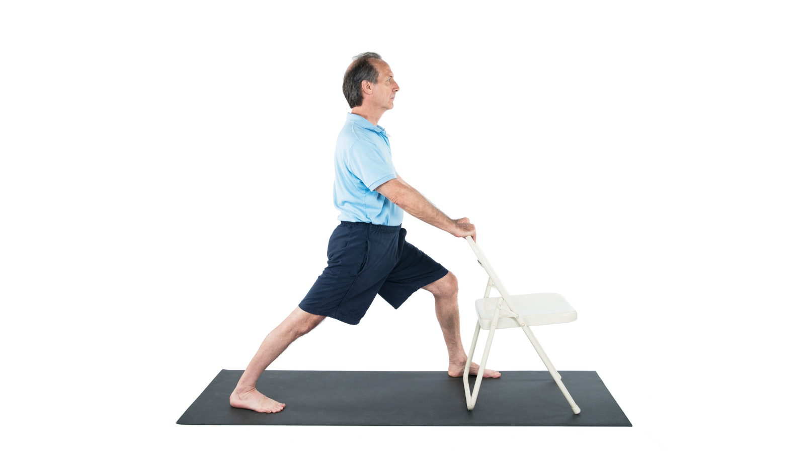 Practicing Warrior I Pose or Virabhadrasana Pose with the support of a chair
