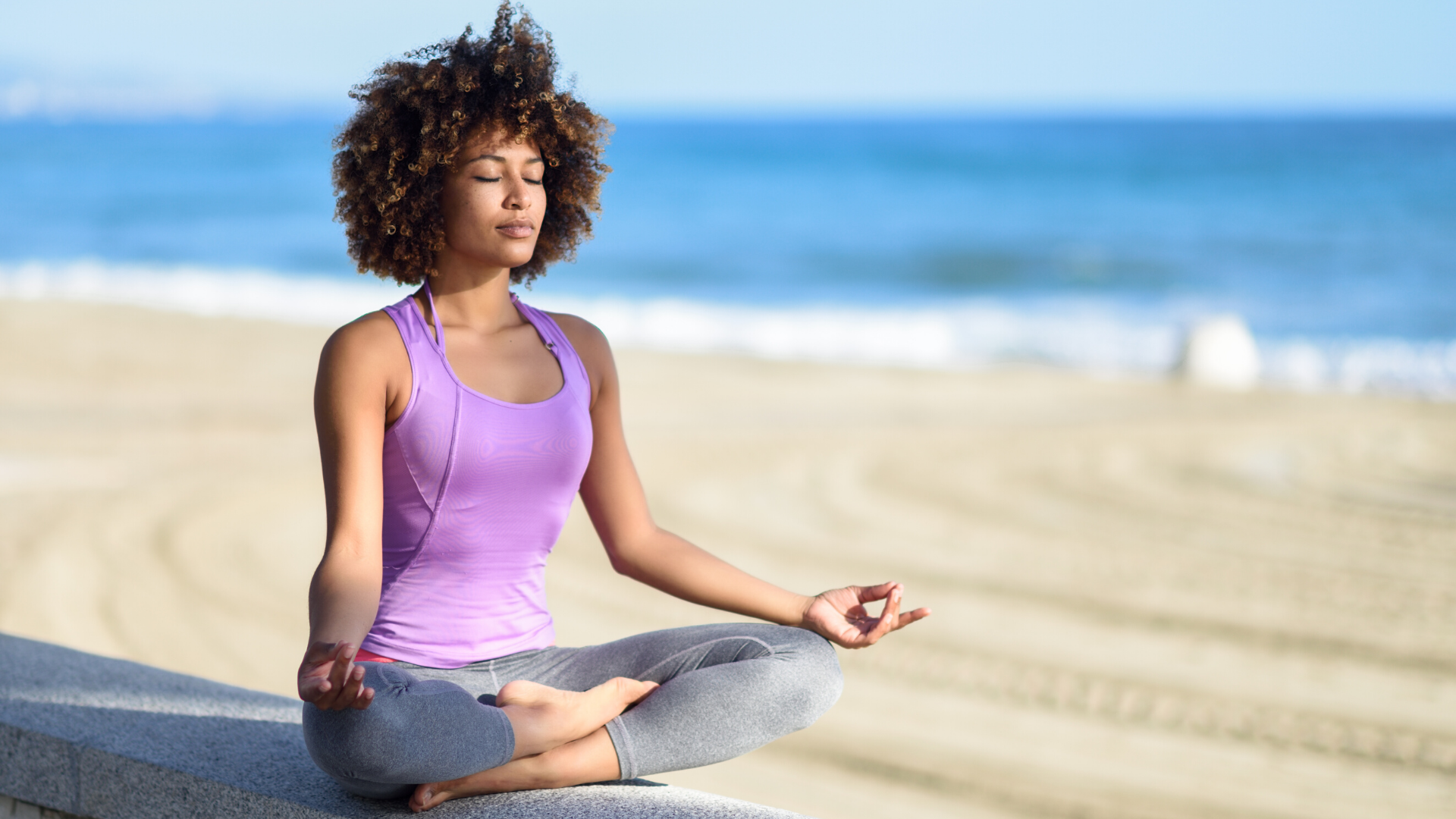 yoga_student_enjoying_the_benefits_of_practicing_meditation_in_nature