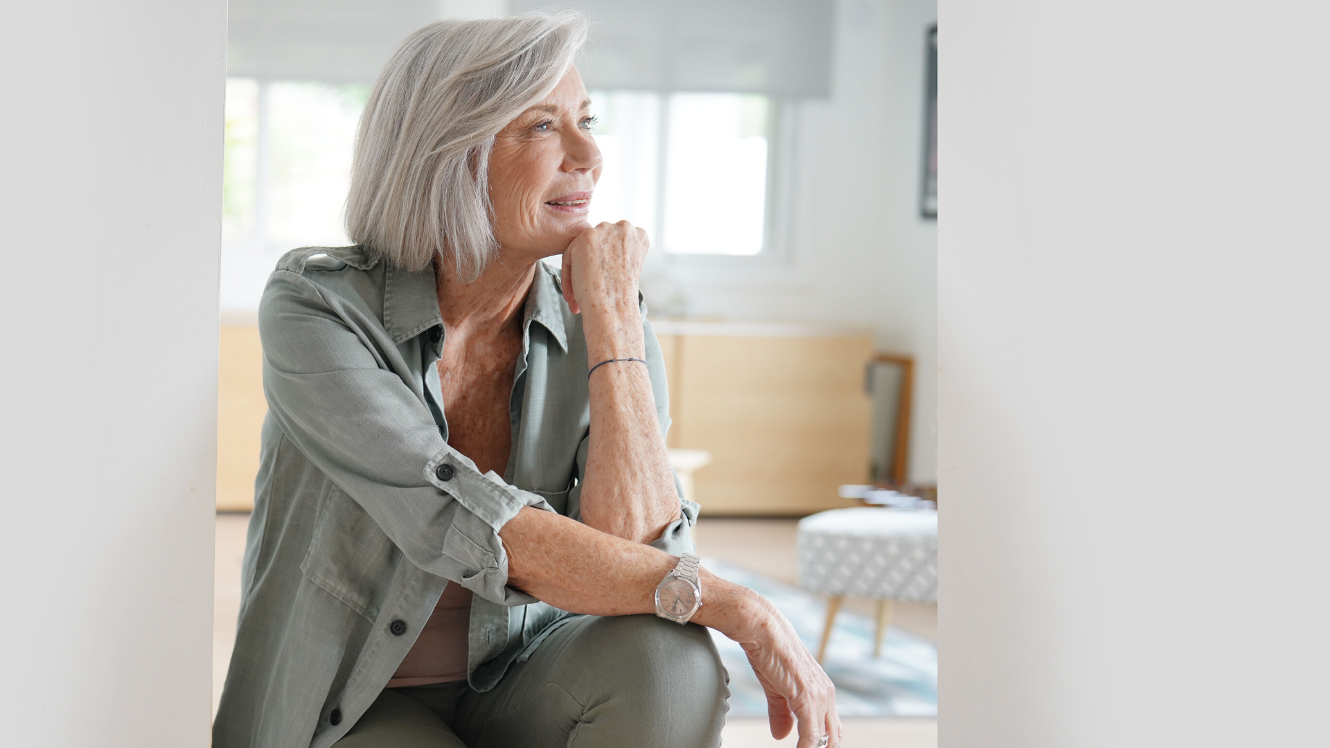 Woman contemplating at home.