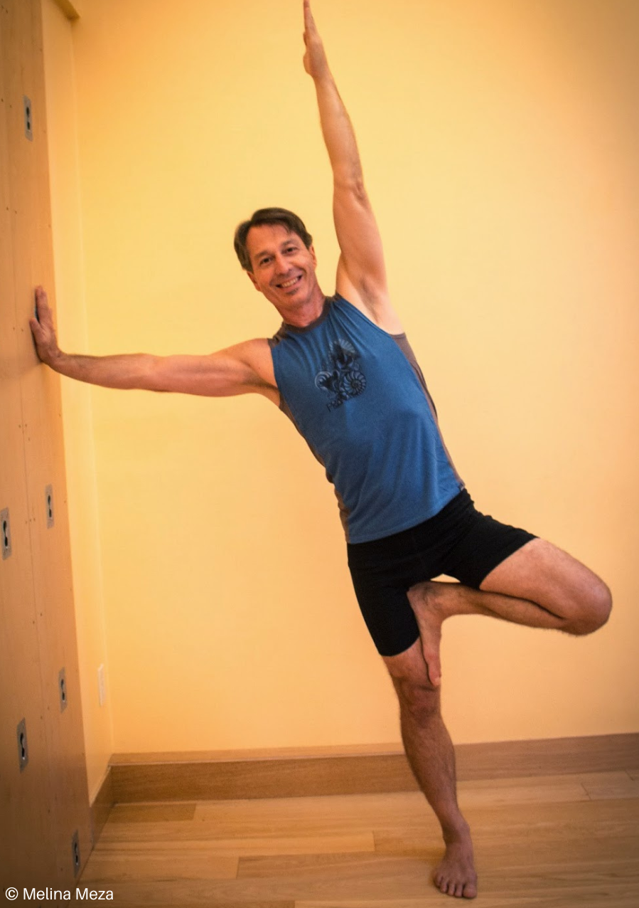 Practicing Side Plank Pose or Vasisthasana at the wall
