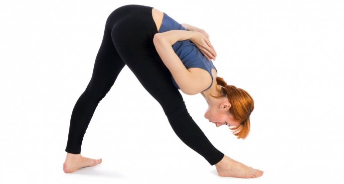 Parsvotanasana woman practicing Parsvotanasana, side stretch pose