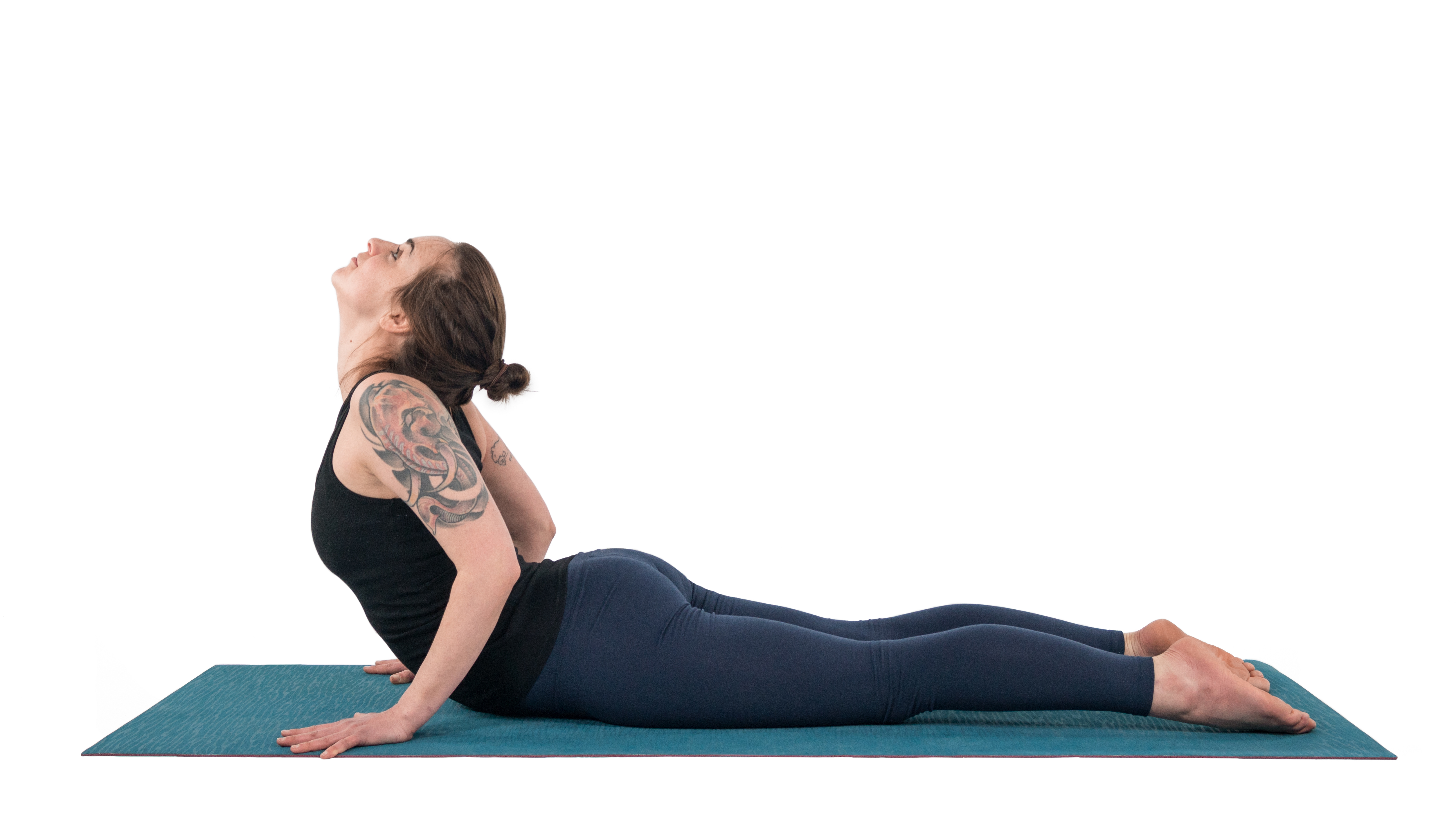 Woman practicing Cobra Pose (Bhujangasana) overarching her neck, which can be bad for the neck and shoulders 