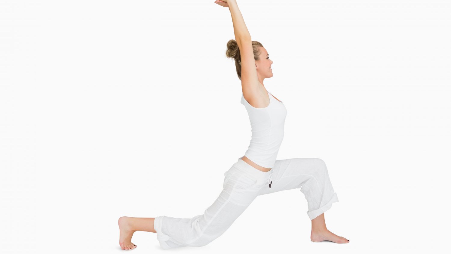 Low Lunge A woman in Low Lunge (Anjaneysana) a yoga pose to promote both steadiness and ease