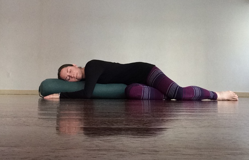 Supta Matsyendrasana, supported spinal twist pose