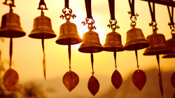 Nepali traditional Bells over the sun at sunset