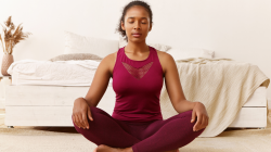 Woman practicing yoga meditation with eyes closed.