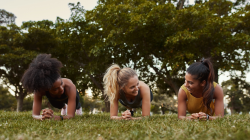 Teens practicing yoga for anxiety in Plank Pose (Phalakasana)