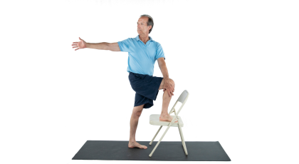 Yoga's Marichyasana Pose using a chair for a gentler twist