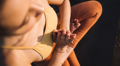 Young woman meditating and tuning into inner yogic wisdom