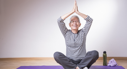 Yoga student practicing to reduce the symptoms of tension headaches