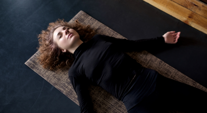 The benefits of practicing Savasana restorative yoga pose to reduce stress and improve sleep