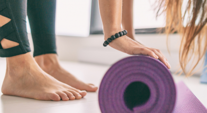 Yoga mat in fitness class for health and wellness including healthy feet