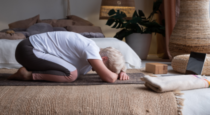 How to practice yoga to promote wellbeing and self-care in Child's Pose (Balasana)