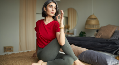 Female yoga student practicing seated twist marichyasana