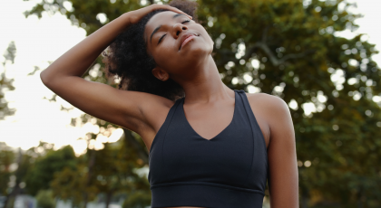 Woman practicing yoga for neck health with a neck stretch