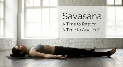 A woman practicing yoga in Corpse Pose (Savasana)