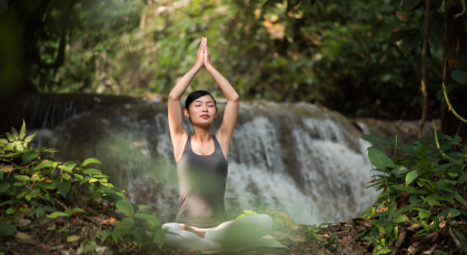 Woman practicing yoga meditation with eyes closed.