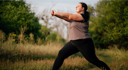 Woman practicing yoga for back pain lunge arm stretch