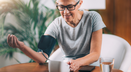 Senior Woman Measuring Blood Pressure at home