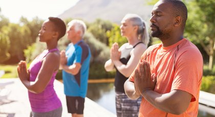 Older African American Man practicing yoga