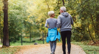 mature couple walking which is great exercise and also good for the psoas muscle