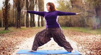 Woman practicing yoga for pain care Warrior II Pose (Virabhadrasana II)