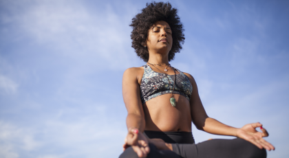 yoga woman cultivating gratitude in meditation pose
