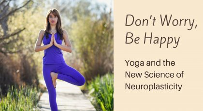 A woman in Tree Pose (Vriksasana) practicing yoga to promote positive attention and improved brain functioning