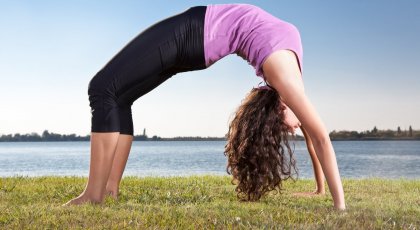 woman doing Urdhva Dhanurasana or Upward Bow Pose, backbend