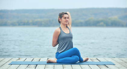 woman practicing gomukhasana