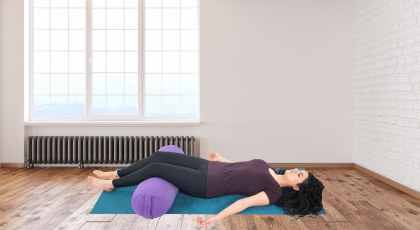 Woman practicing yoga for jaw discomfort Corpse Pose (Savasana)